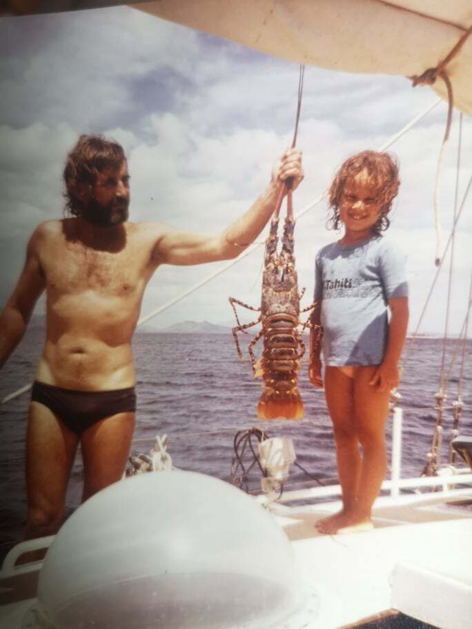 Michel Riboni and his daughter Moema admiring a fish aboard Feo